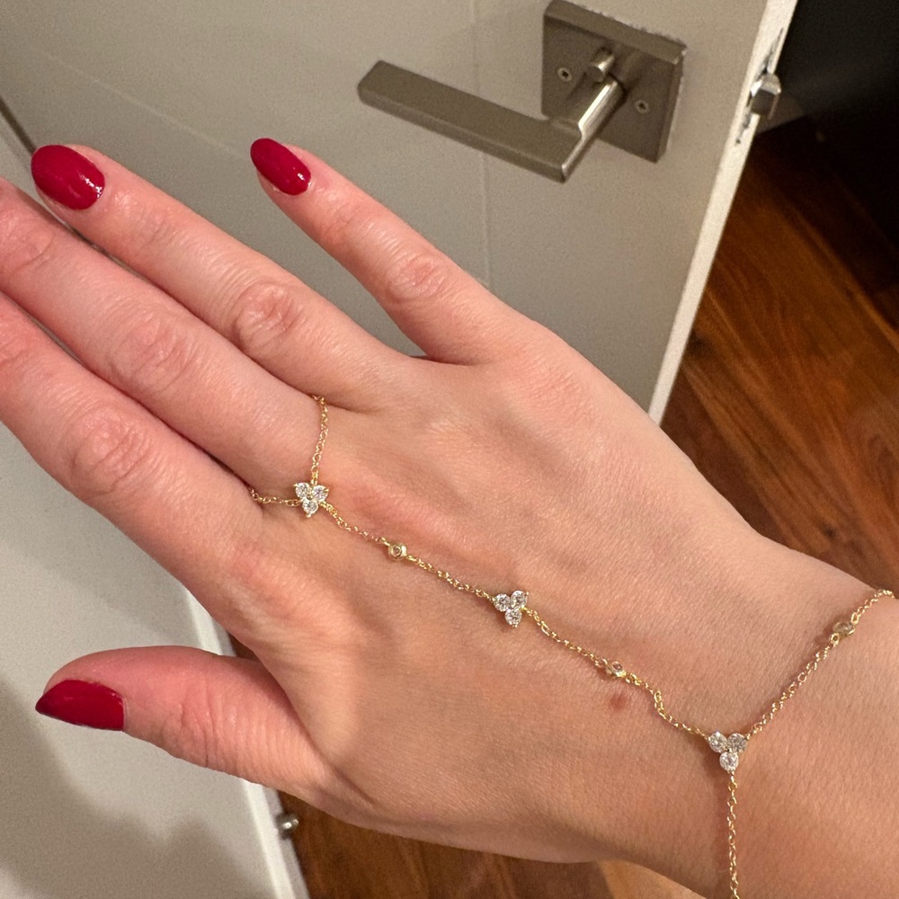Gorgeous Gold hand chain with trillion design
